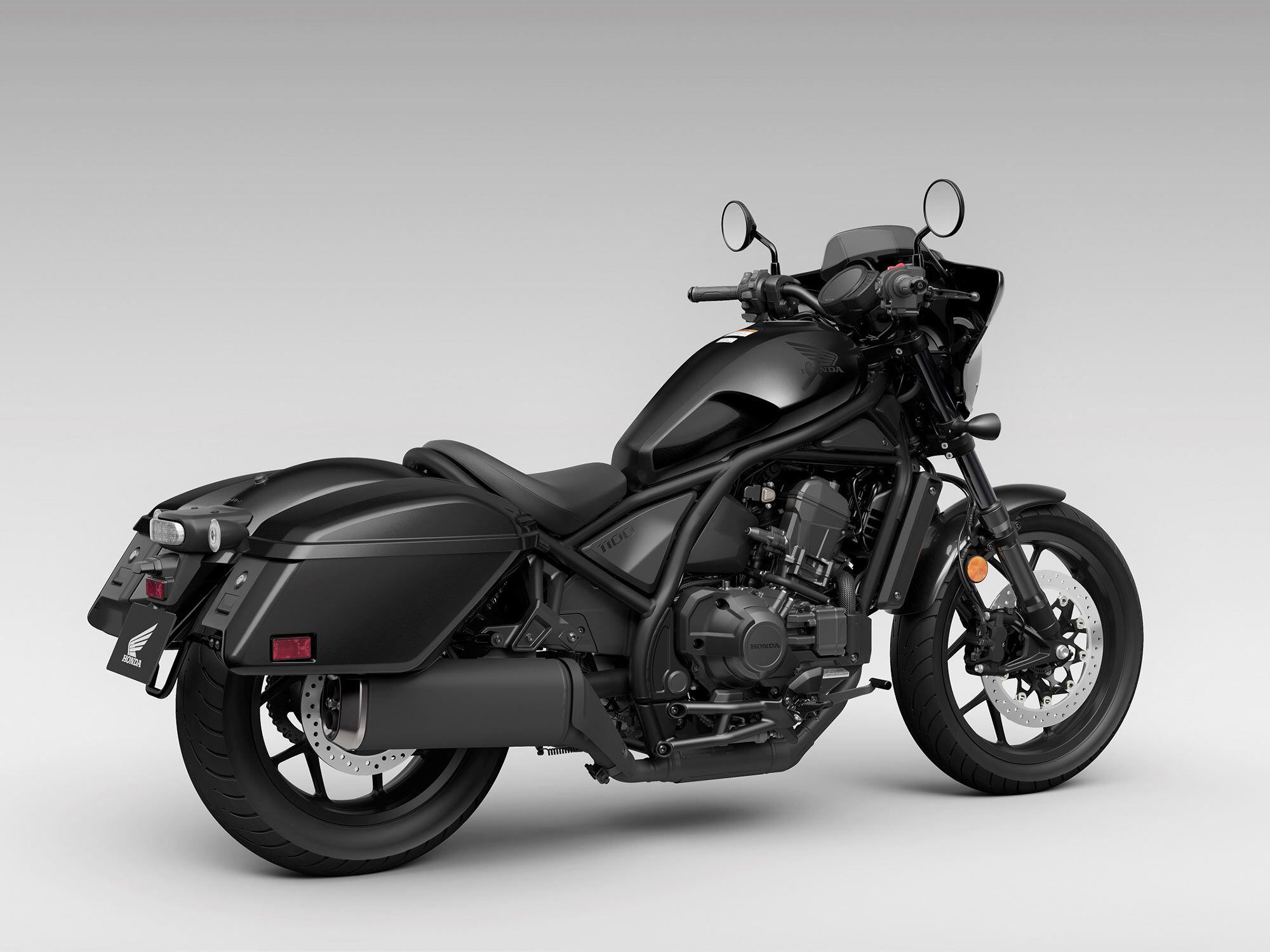 The 1,083cc parallel-twin engine carries over unchanged. In Metallic Black, nearly every part of the 1100T looks dark.