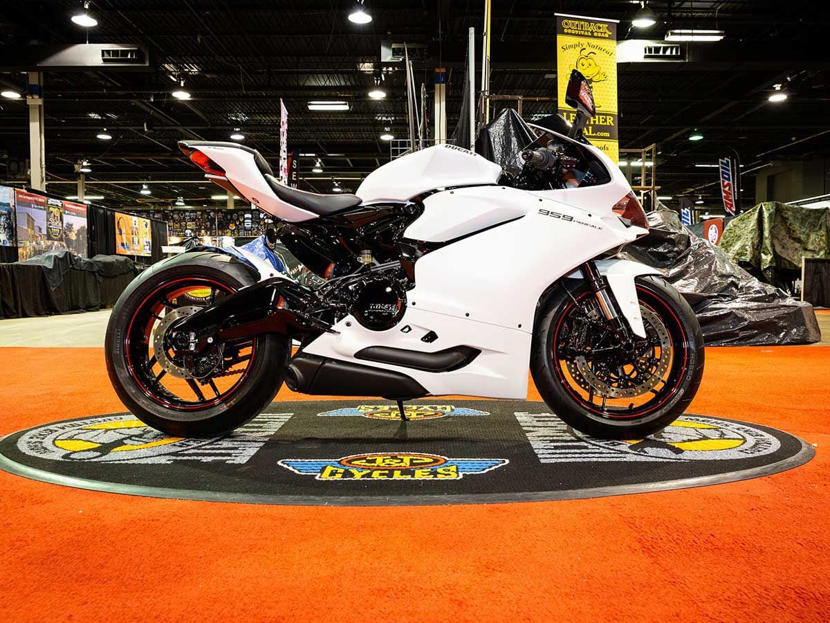 Keith Castellano tore this 2016 Ducati Panigale 959 down to the frame, and worked with his painter Gator to reimagine the subframe and engine (painted black) with backlit Ducati branding and matte-white plastics.