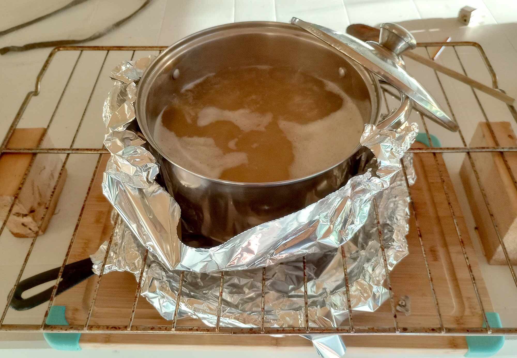 Pasta is boiled over a makeshift Sterno stovetop.