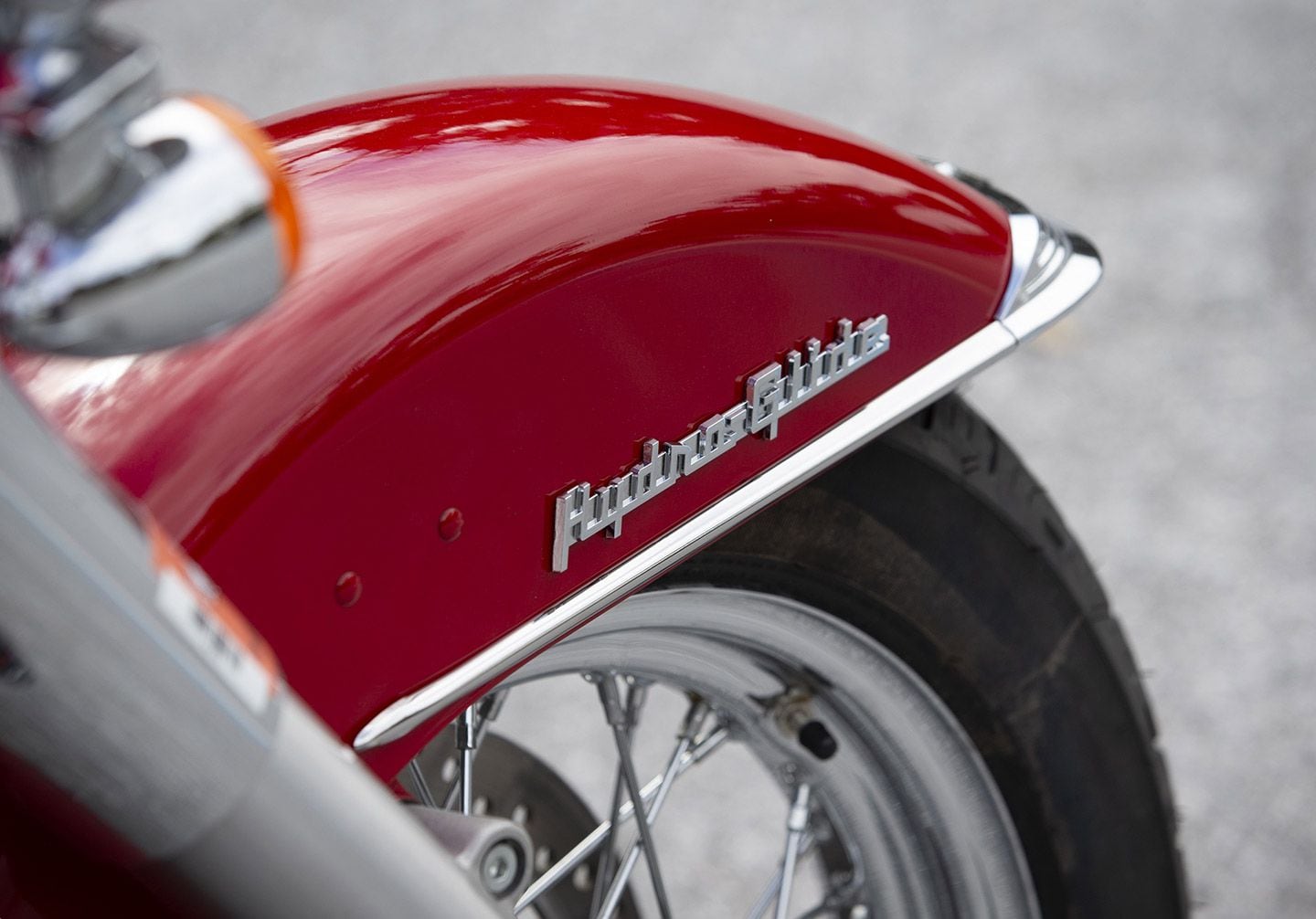 Matching Hydra-Glide badging on chrome-trimmed fender betrays Streamline influences seen in the era.