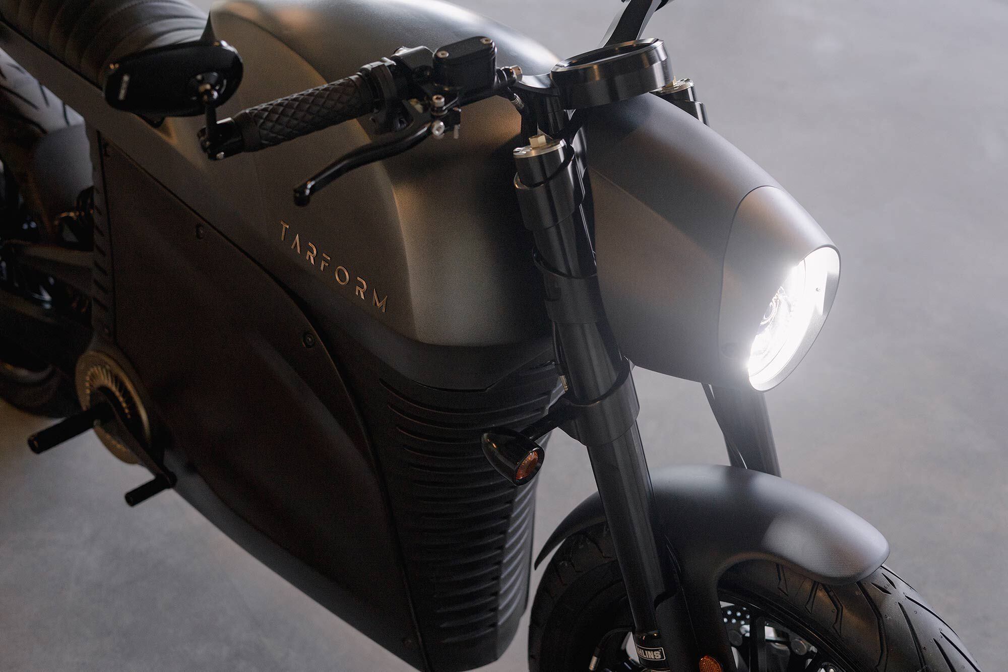 The Racer’s sleek fairing-like headlight bucket and black-out bits (and street-biased tires) distinguish it from the Scrambler model.