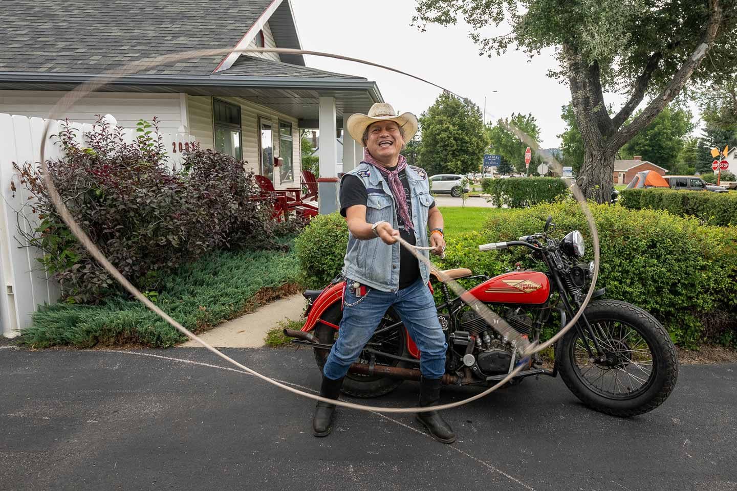 Jose Torres (@blue1932vl) shows off his roping skills in front of his 1934 Knucklehead during the Sturgis Motorcycle Rally.