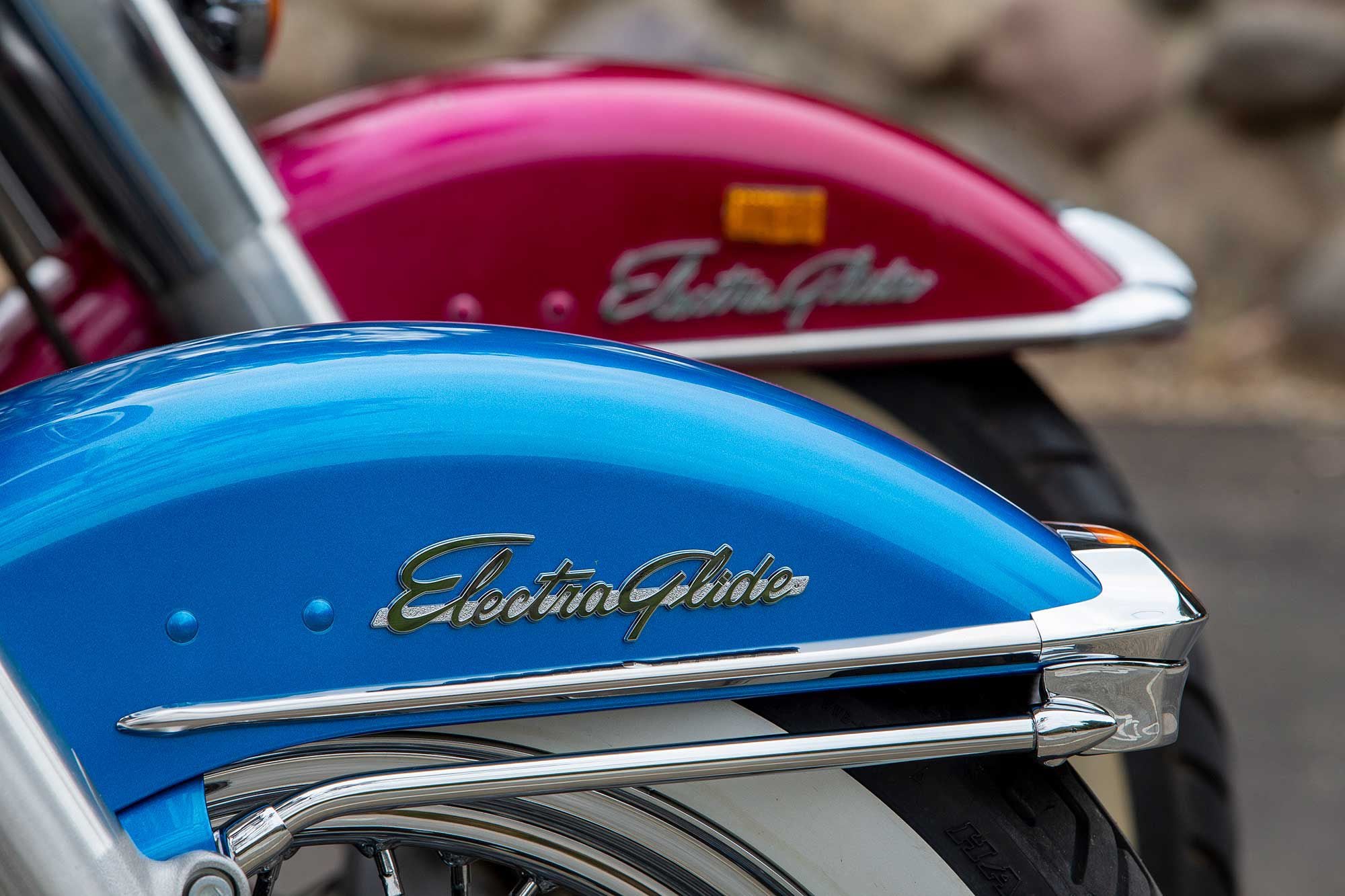 The classic Harley-Davidson Electra Glide insignia adorns the Revival’s front fairing and the FLH behind it.