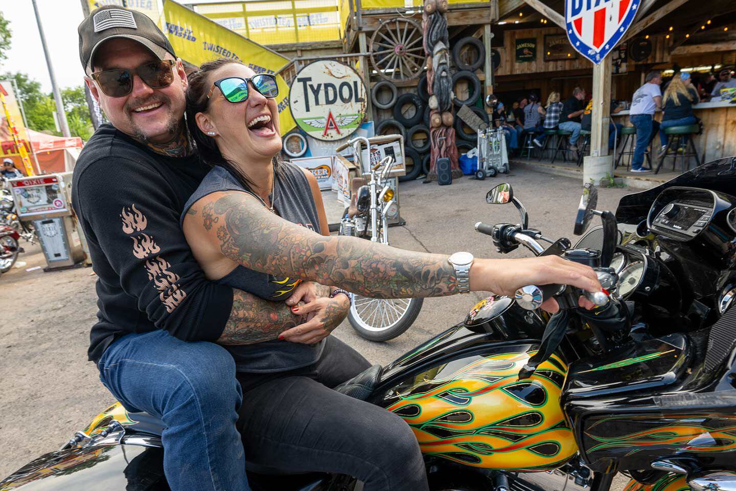 Ladies to the front, as they say. Jody Perewitz gets a squeeze from friend Paul Wideman of Bare Knuckle Choppers.
