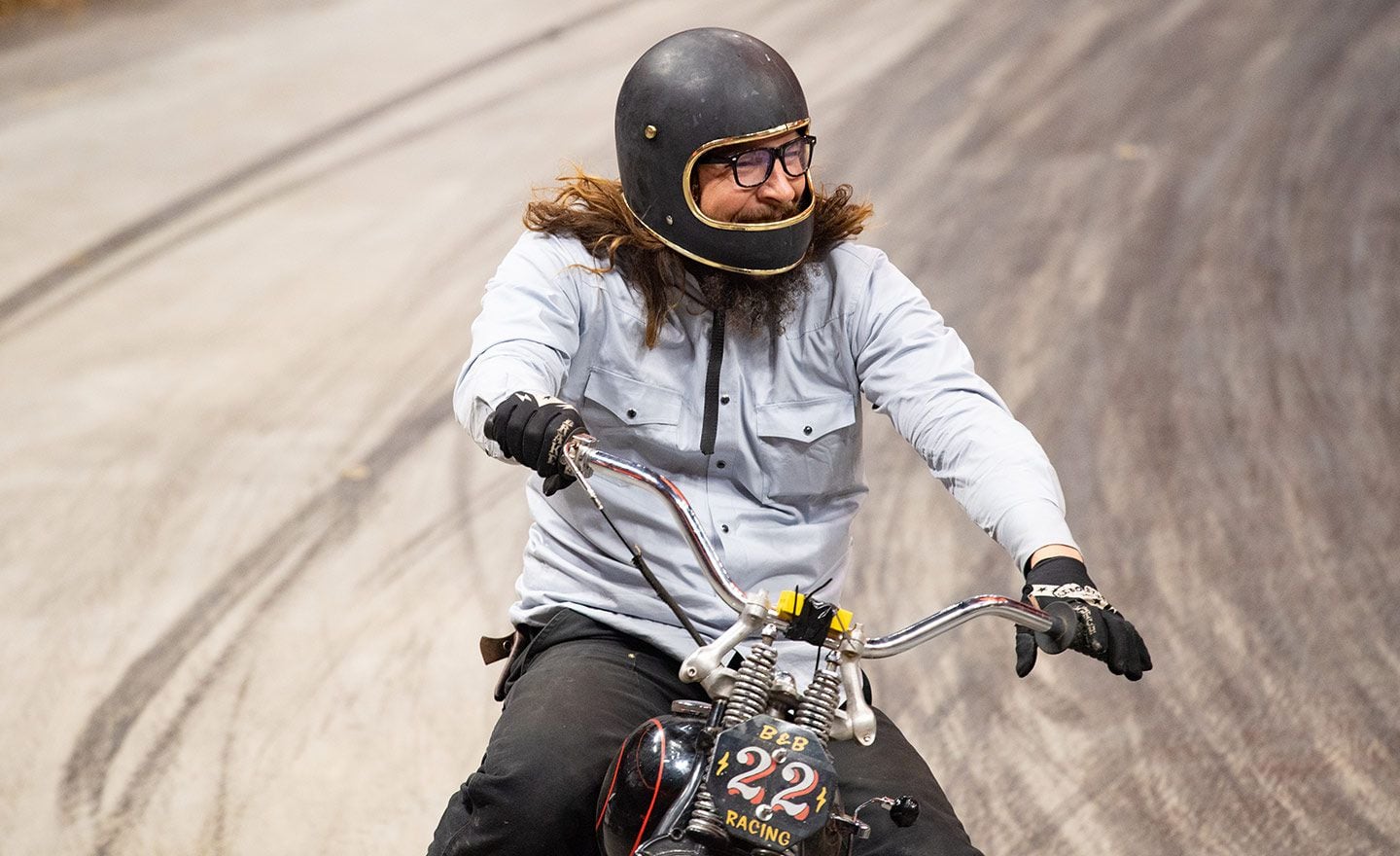 Can’t hide that smile: Danger Dan negotiates the Open Amateur class race.