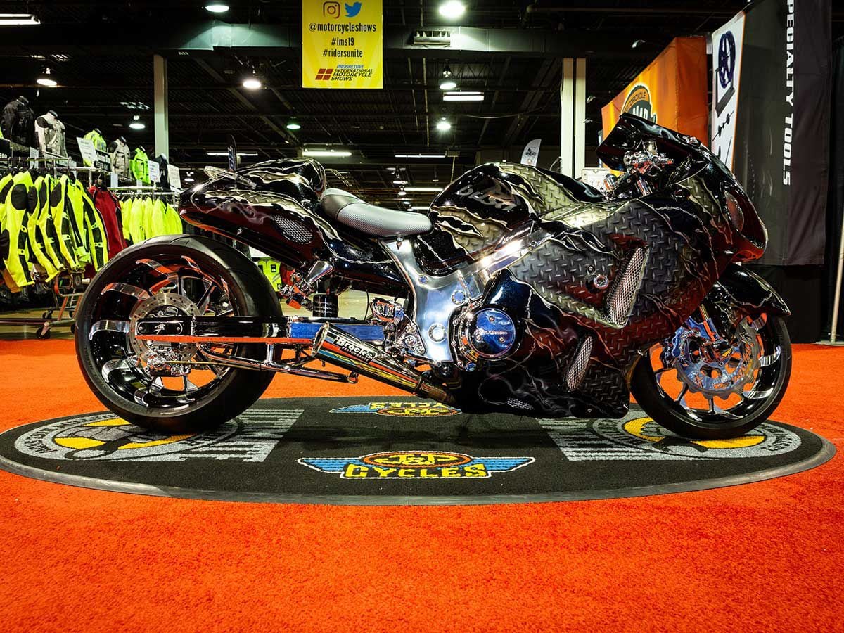 Talk about imagination: Juan Rodriguez channeled some serious fire with this 2004 Suzuki Hayabusa-based build, rolling on a 300 rear tire with air suspension. Can’t miss that airbrushed custom paint either, or the LED lights, molded windscreen, custom front fender, polished frame, and wickedly stretched swingarm. It’s no wonder it also won its class for the Chicago round.
