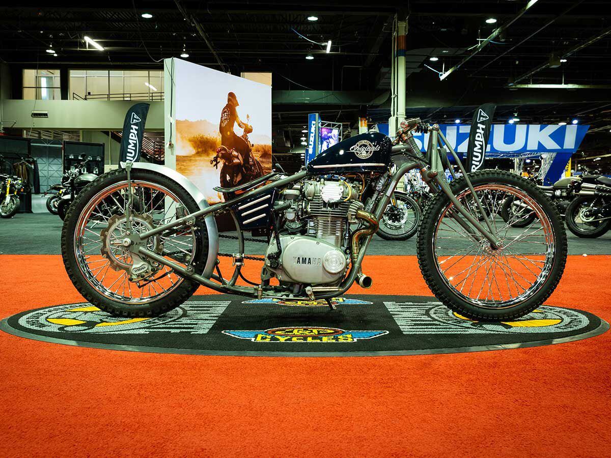 Austin Andrella and painter FT Customs/Hamilton Design Company rolled out this absolutely spartan 1976 Yamaha XS650 with an <a href="http://austinmartinoriginals.blogspot.com/">AMO</a> frame, AMO handlebars, AMO fender struts, matching 21-inch wheels, Barnett clutch plates and springs, and AMO gas tank and airbox.