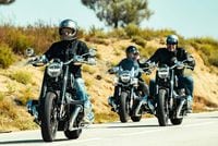 bmw r 18 cruisers riding on country road