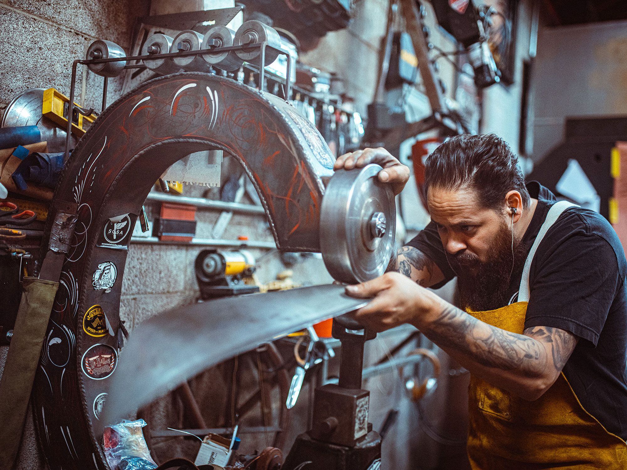 Sosa working the English wheel on one of the larger bodywork panels.