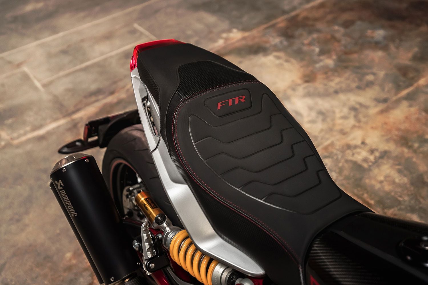 The new sporty seat and raw aluminum tailsection of the top-shelf FTR R Carbon.