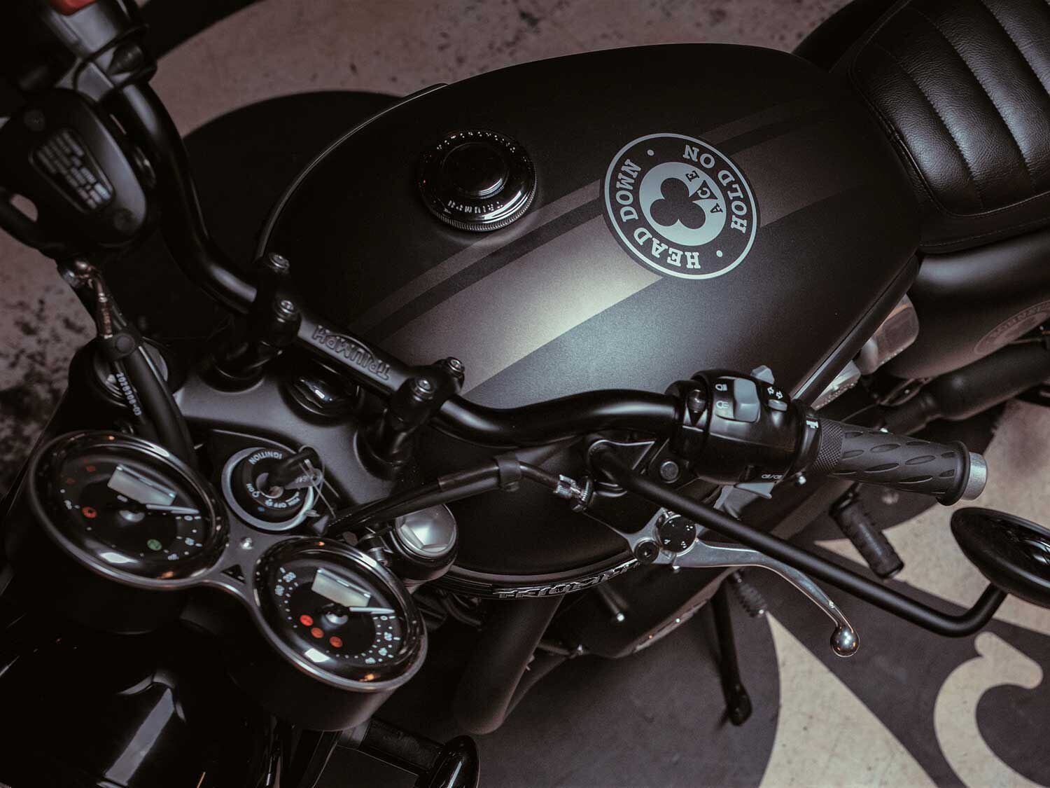 Seems appropriate. The classic “Head down—Hold on” phrase is emblazoned on the tank of the Bonneville T120 Ace edition.