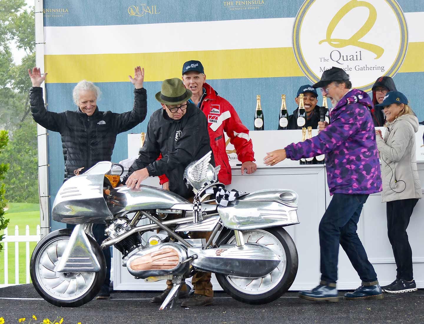 Master of ceremonies Paul d'Orleans seems pretty stoked for Barry Weiss and his wild, Art Deco–inspired Norton Commando, which won the Spirit of the Quail Award.