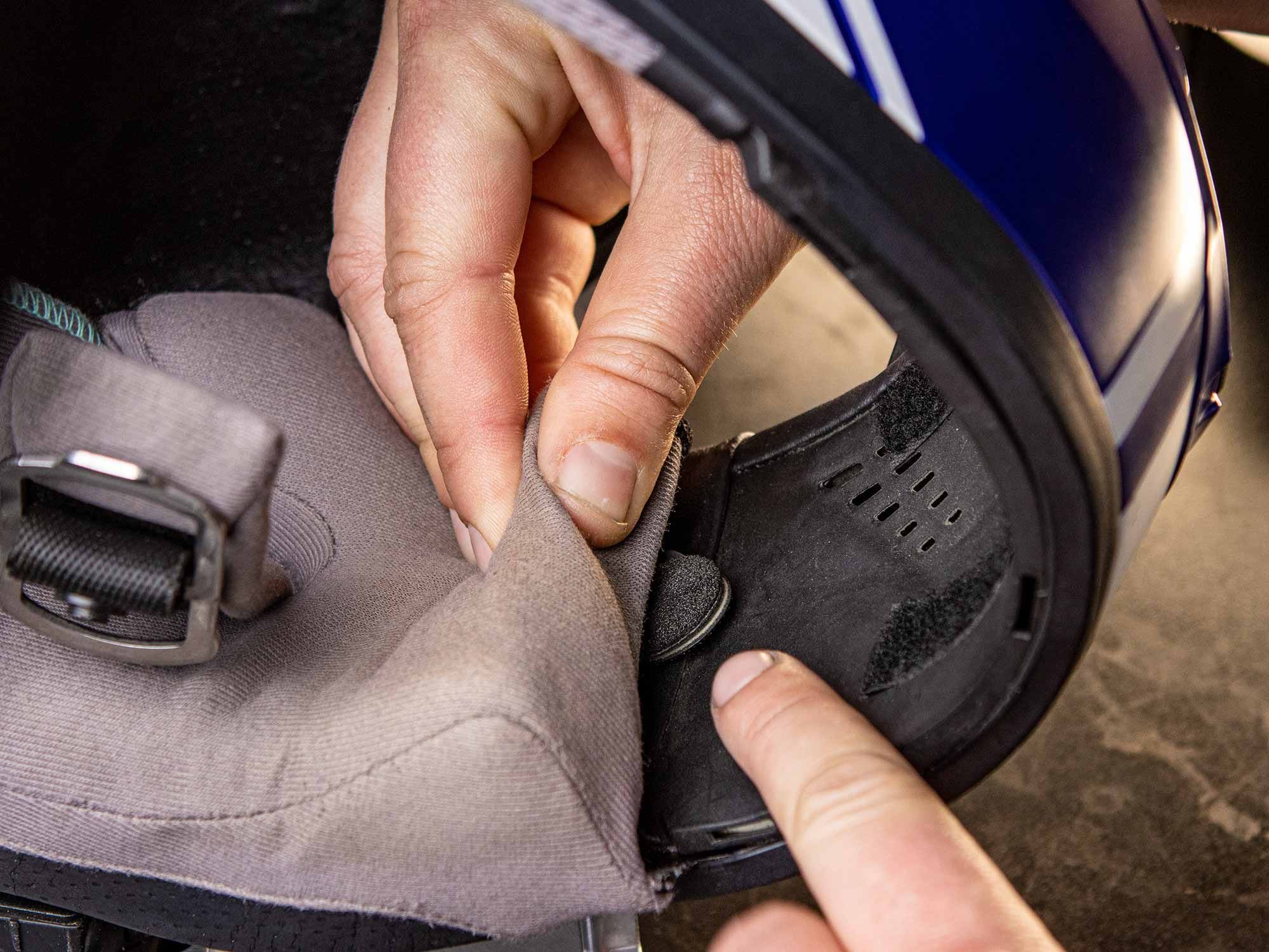 Partially tucking your microphone into your cheek pad is a great way to reduce wind noise.