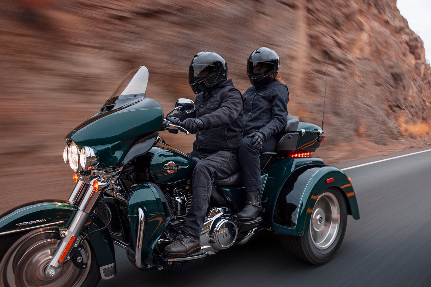 The Tri Glide's top case includes a plush backrest to boost passenger comfort and safety.