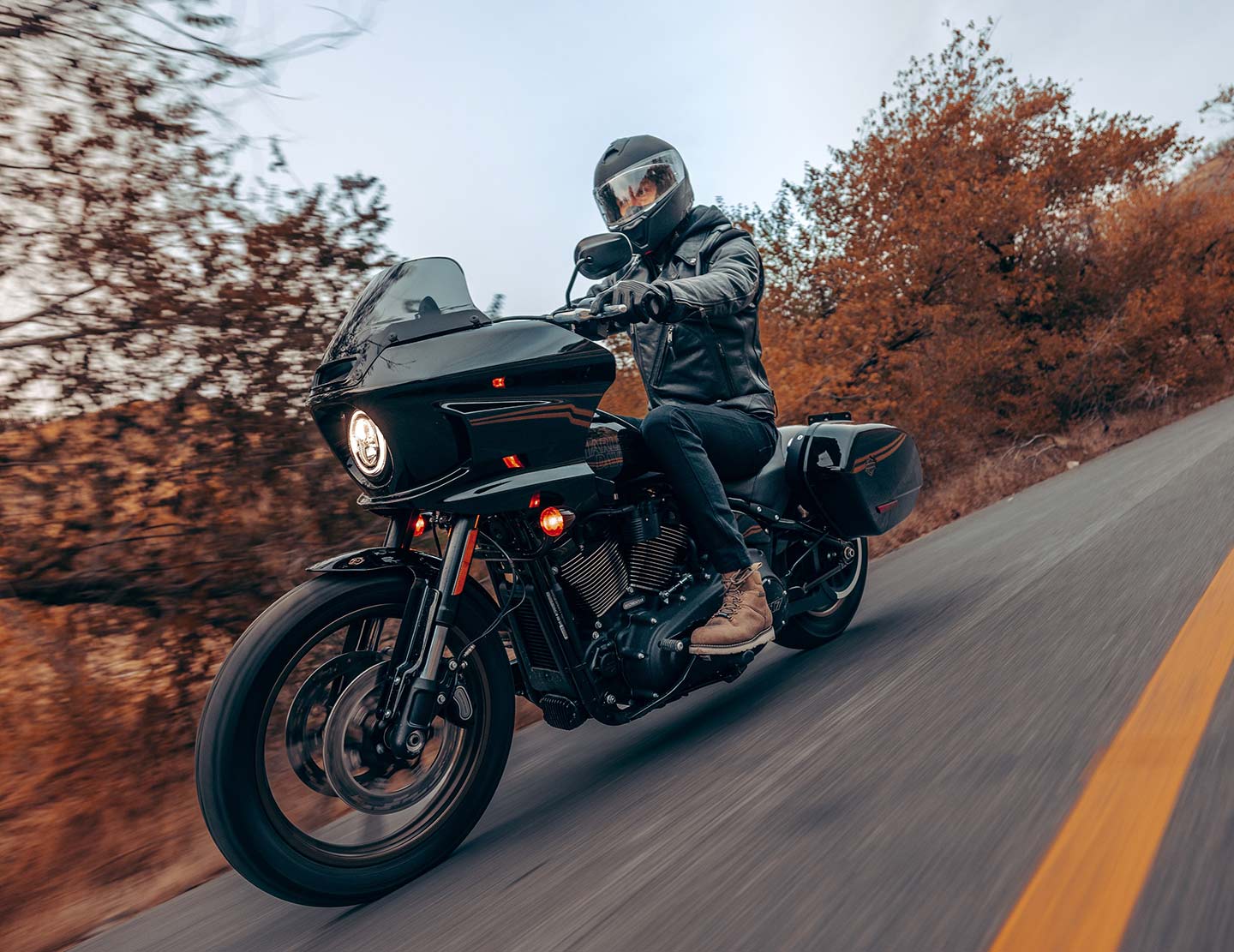 The 2024 Low Rider ST carries on with its performance-first vibes featuring a jacked-up rear suspension, high handlebars, and beefy M-8 117 engine.