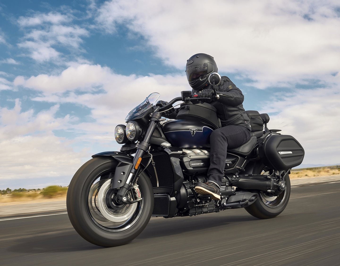 The Storm GT model gets different ergonomics, with forward controls, pulled-back bars, and a lower, dished saddle. Here it's pictured with a bunch of accessory items.