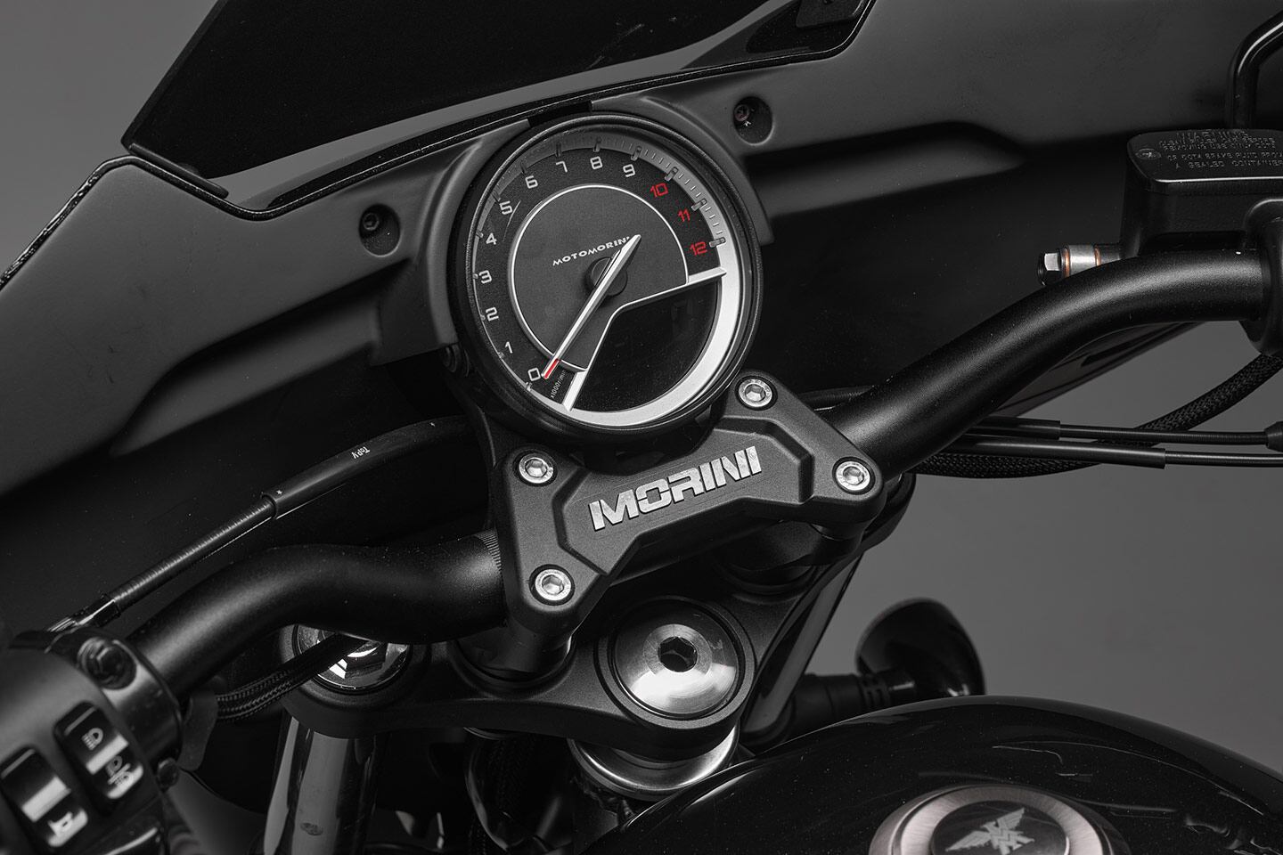 Retro-looking analog-ish gauge has an LCD inset to display other key bike info.