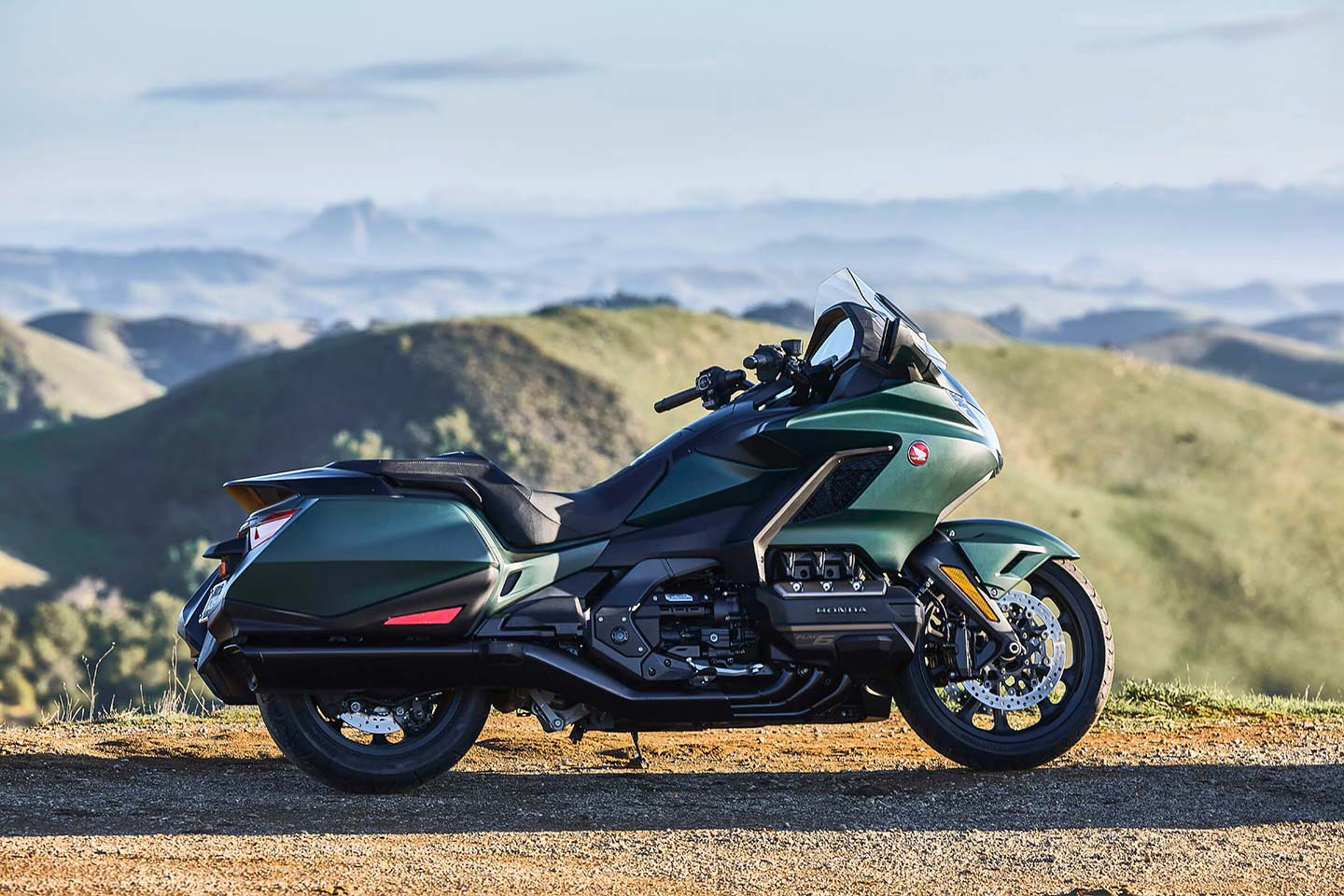 The Honda Gold Wing is usually thought of as a dresser, but the 2024 base model shown here, with its integrated hard bags, is all bagger.