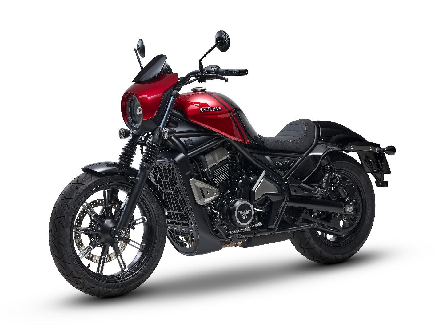 Modern bits include a headlight shroud with mini-visor and LED lighting. Is it us or does that tank look like it came off a Rebel? Props for that slick radiator cover though.