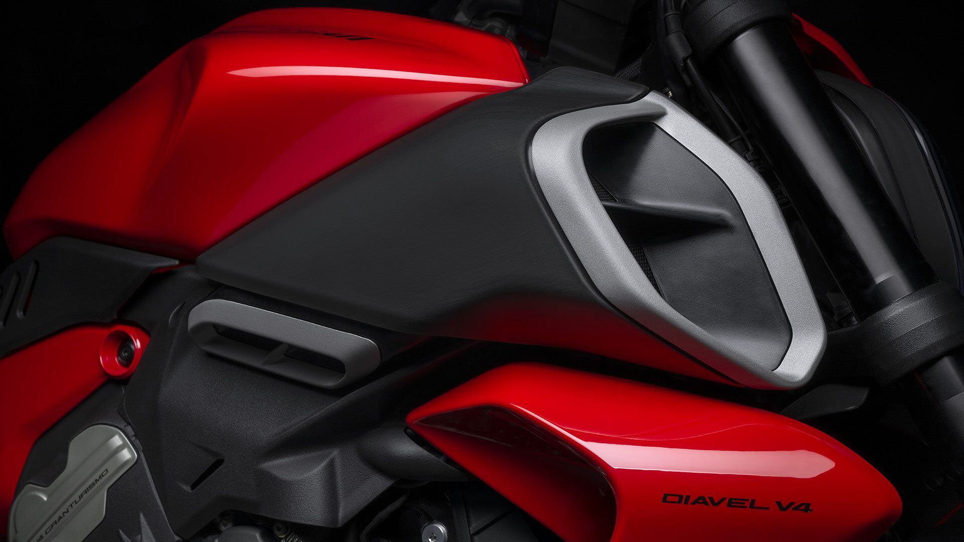Large dual air scoops integrated into the new fuel tank also serve as a de facto design element.