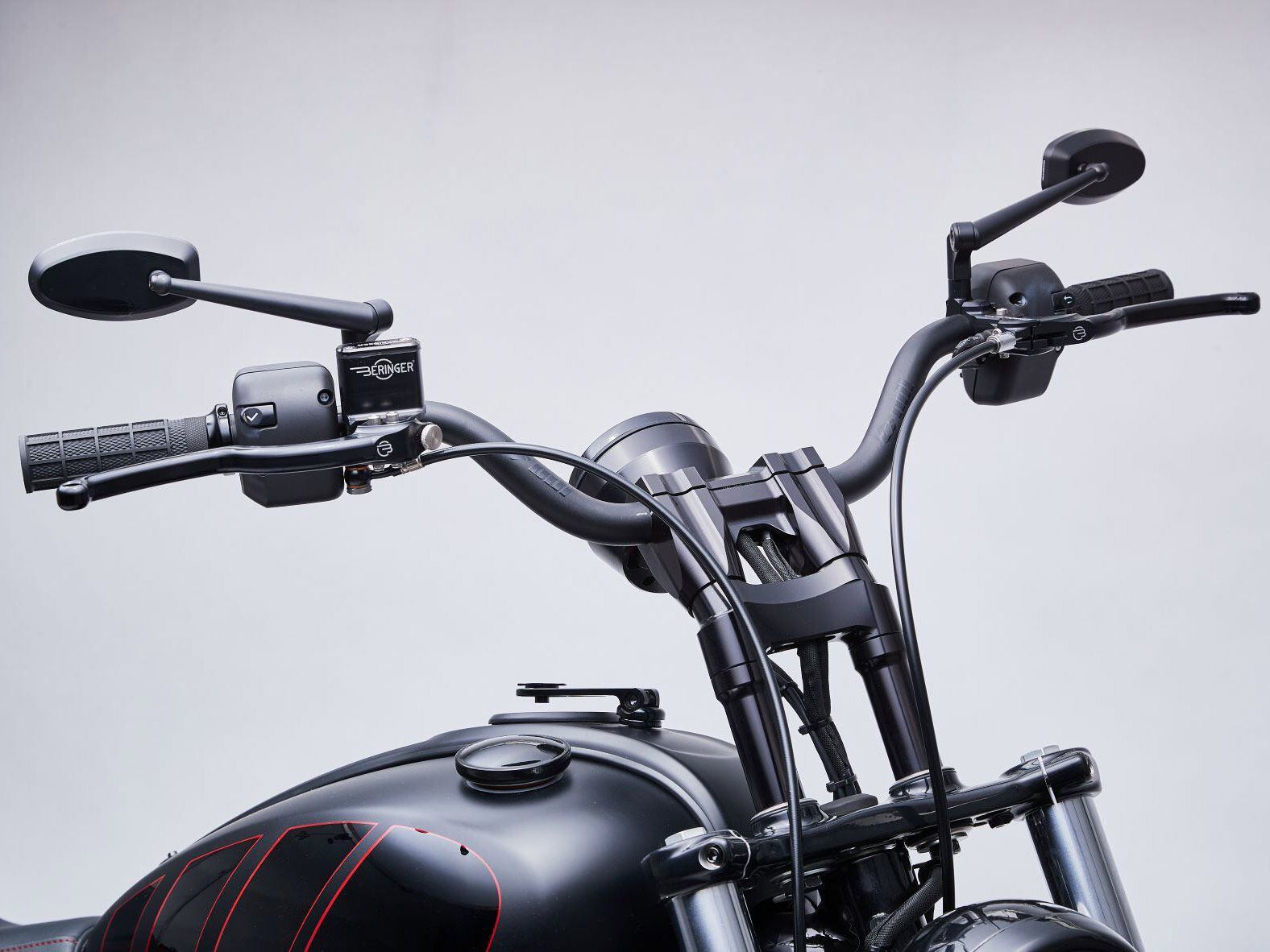 ODI bars are positioned 3 inches taller over stock thanks to Kraus risers and bar mounts.